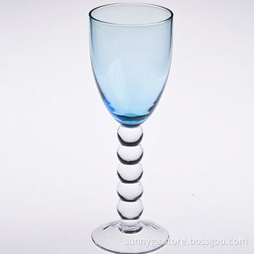 Hand blown wine glass with blue colored stem